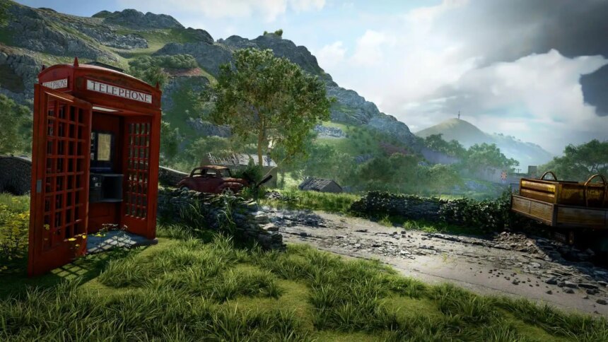 A red phone booth sits on a country lane that